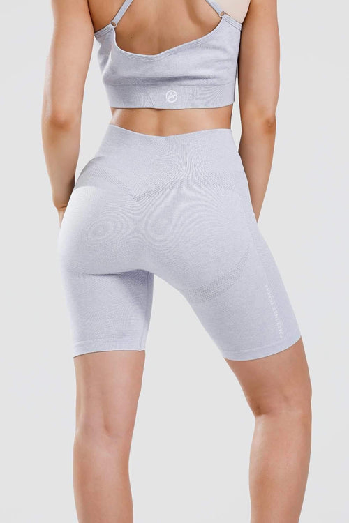 Close up shot of girl wearing calypso seamless set in blue marl from behind