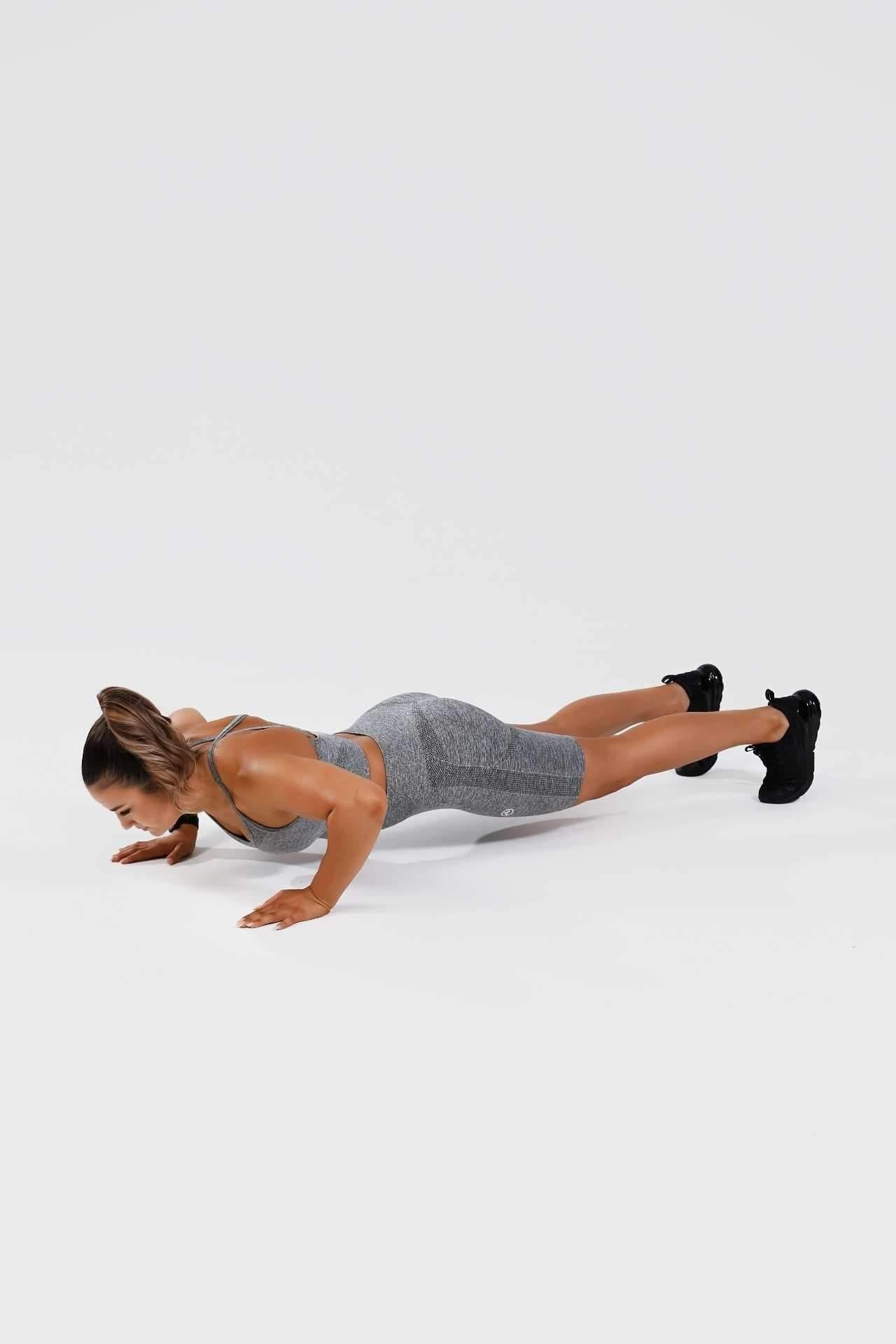 Girl doing push up wearing grey calypso seamless set