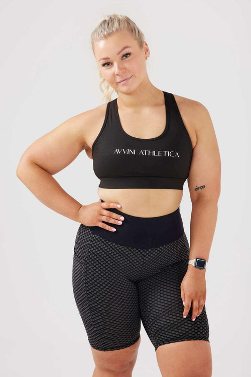 Girl wearing classic crop top and luna shorts in black 
