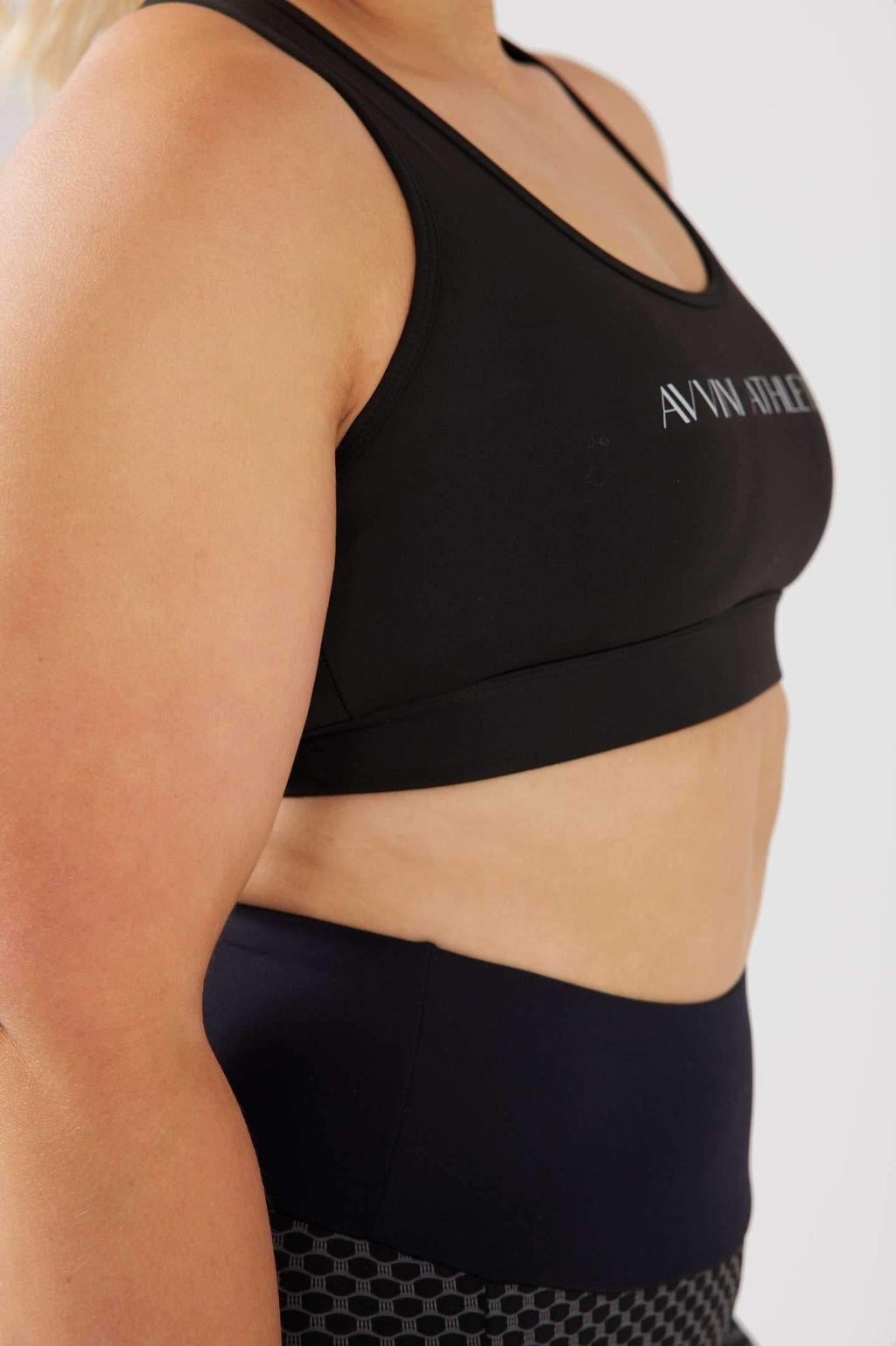 Side close up girl wearing black classic crop top