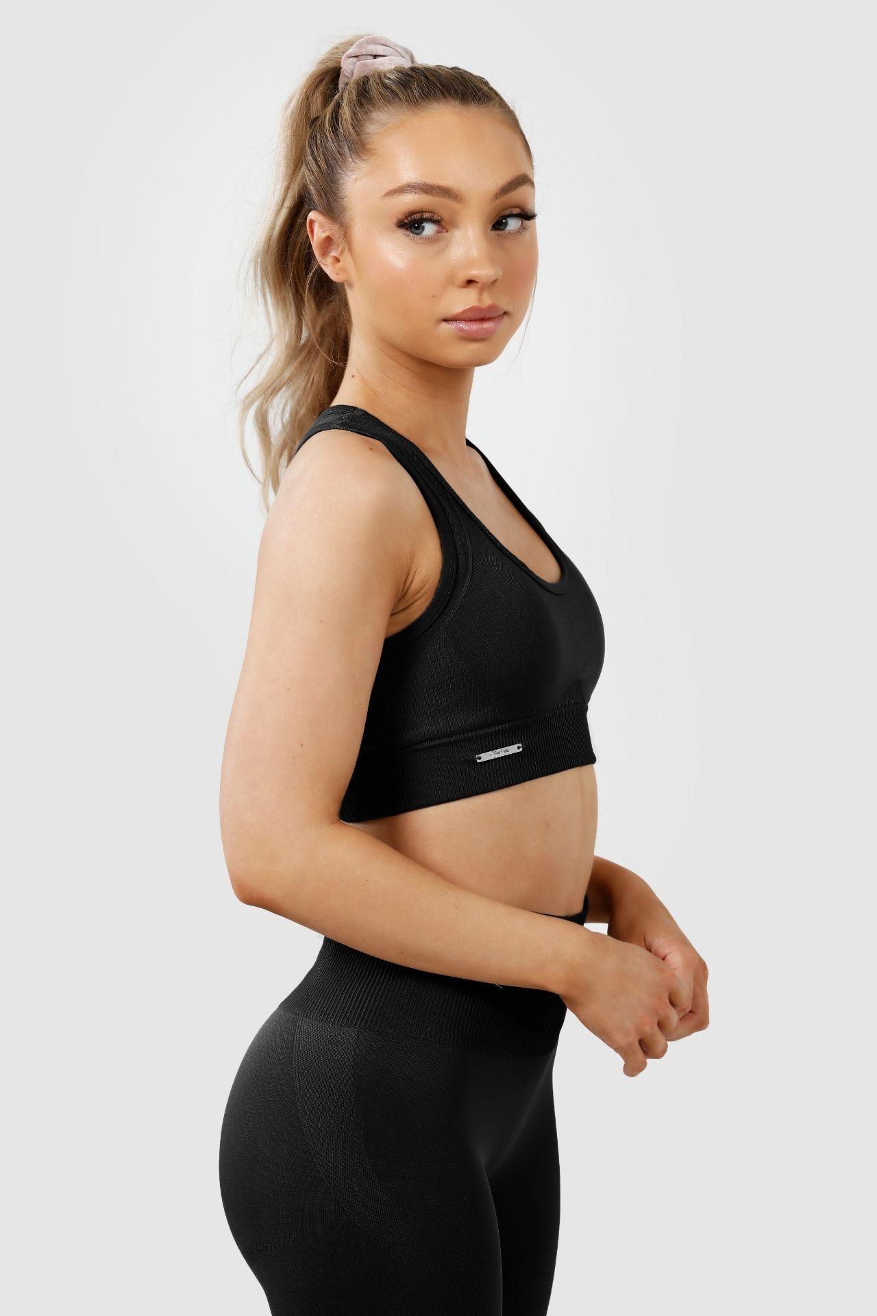 Girl wearing invictus seamless crop in black, side 