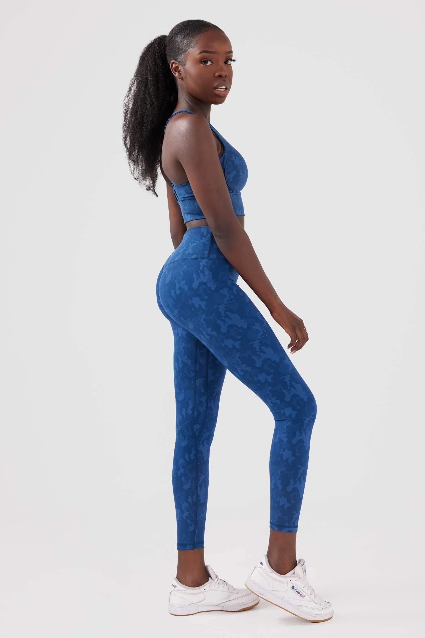 Side view girl wearing legacy scrunch bum set in blue 