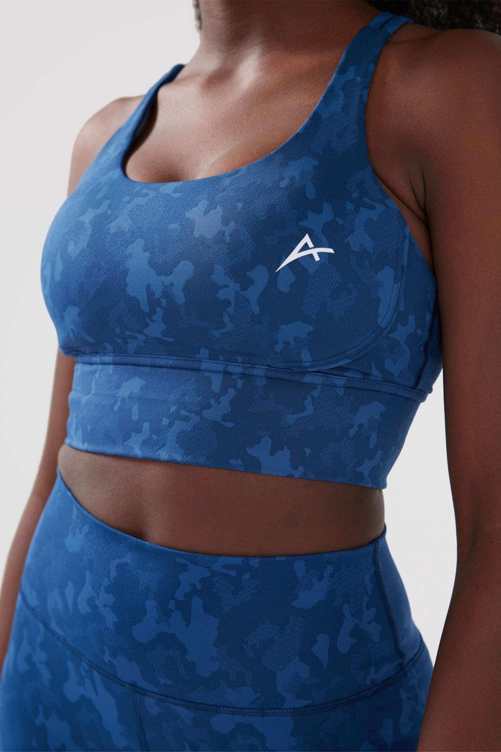 Girl wearing legacy scrunch bum set close up in blue 