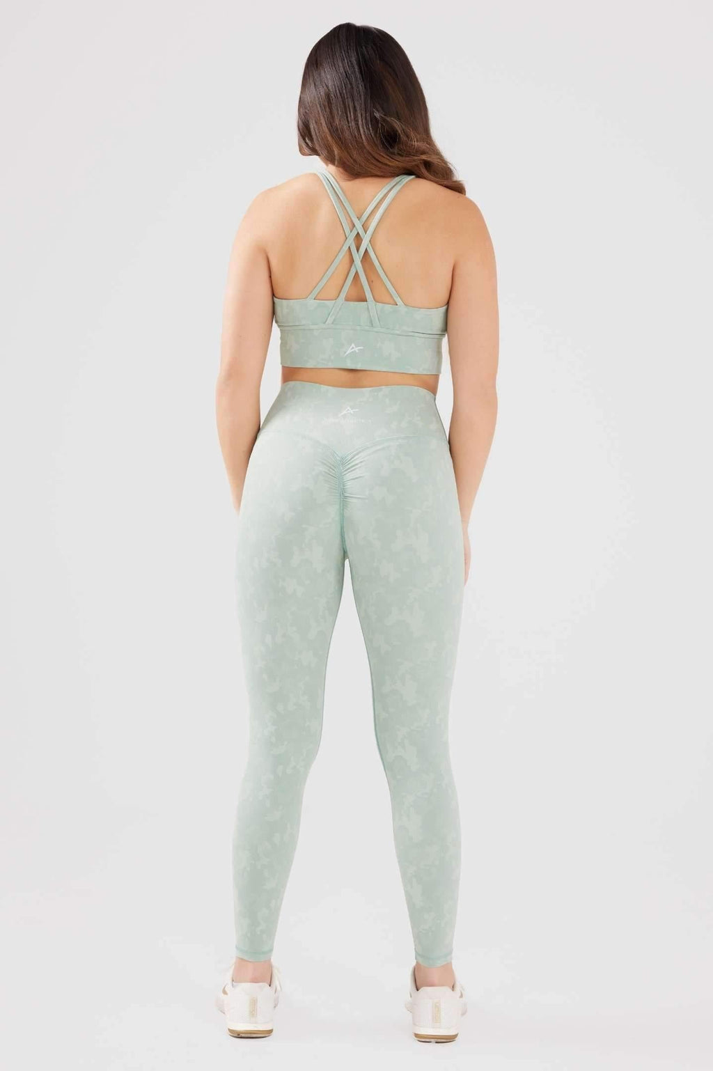 Girl wearing legacy scrunch bum set in mint back