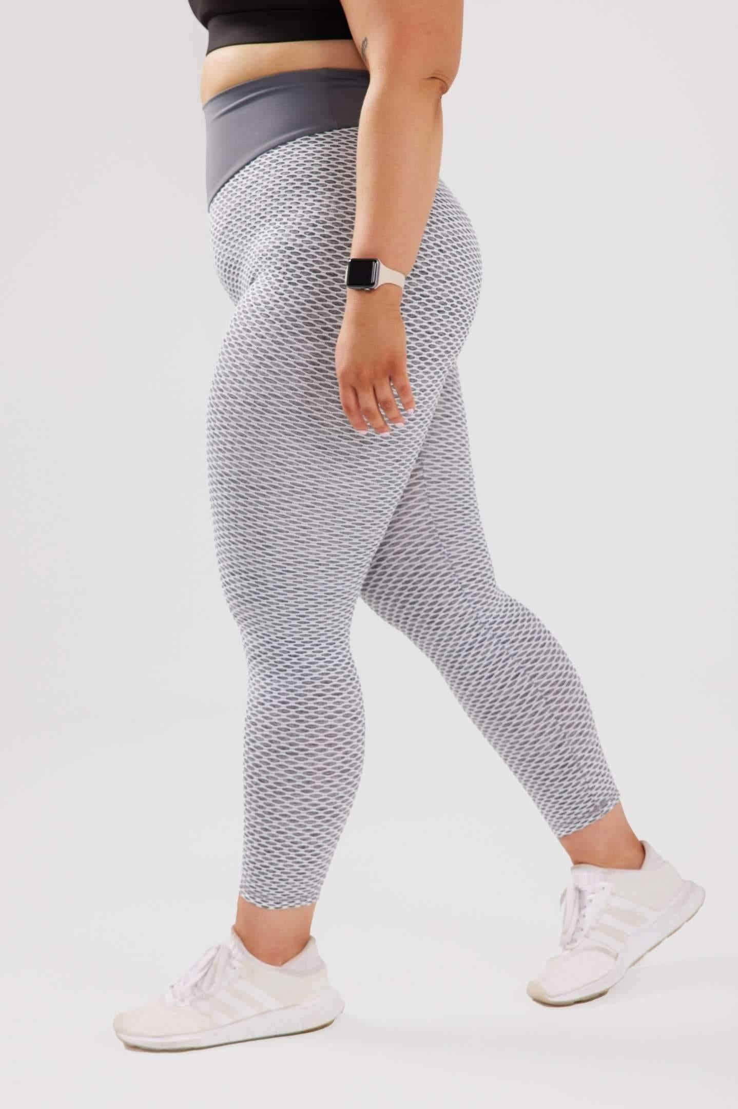 Side view girl wearing large grey luna scrunch bum leggings 