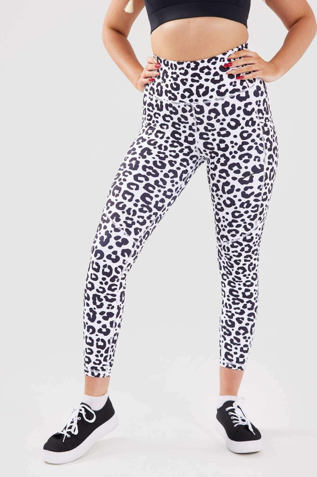 close up girl hands on hips wearing luxe scrunch bum pocket leggings front