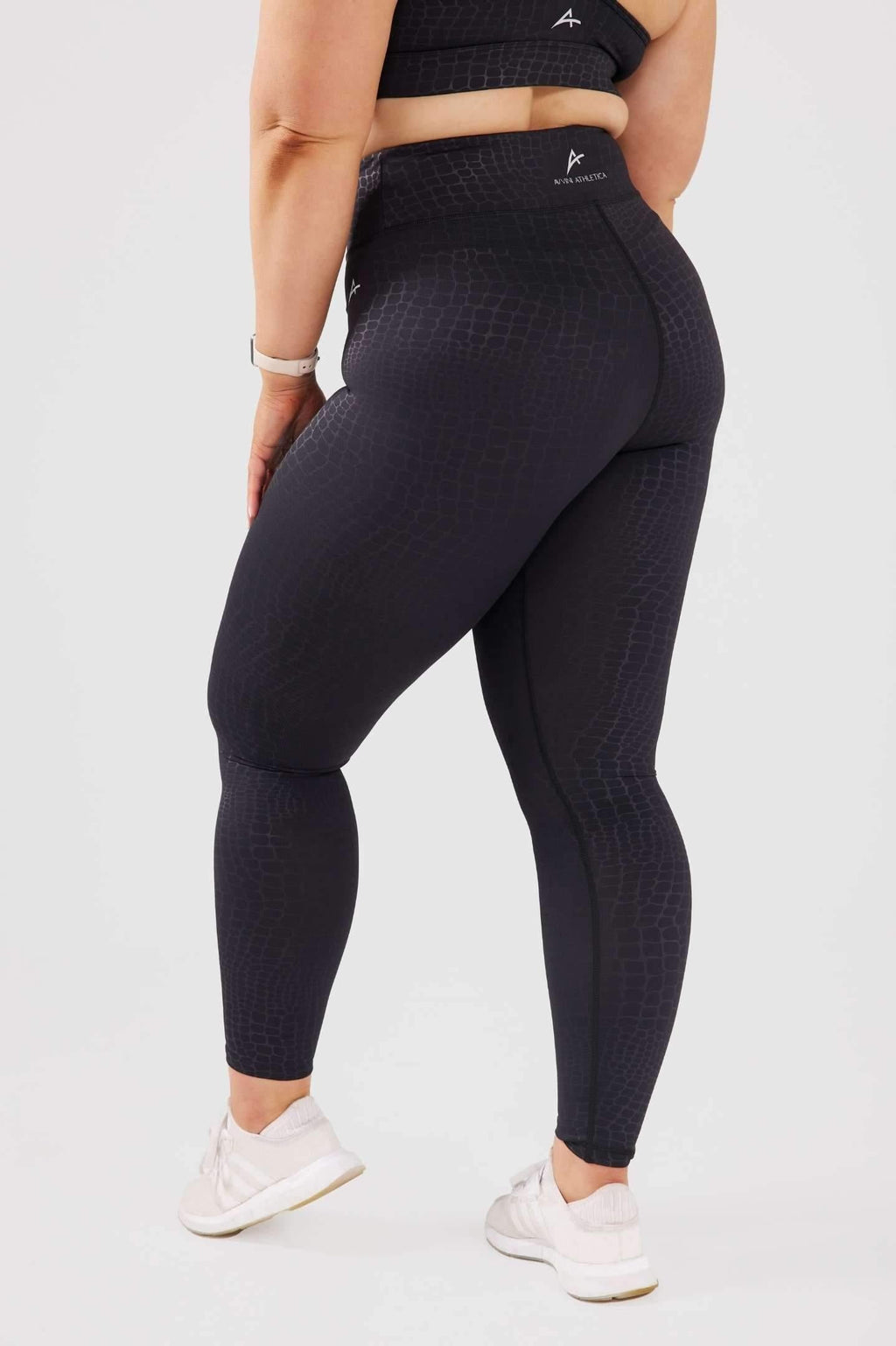 Close up girl wearing snake print luxe leggings back 