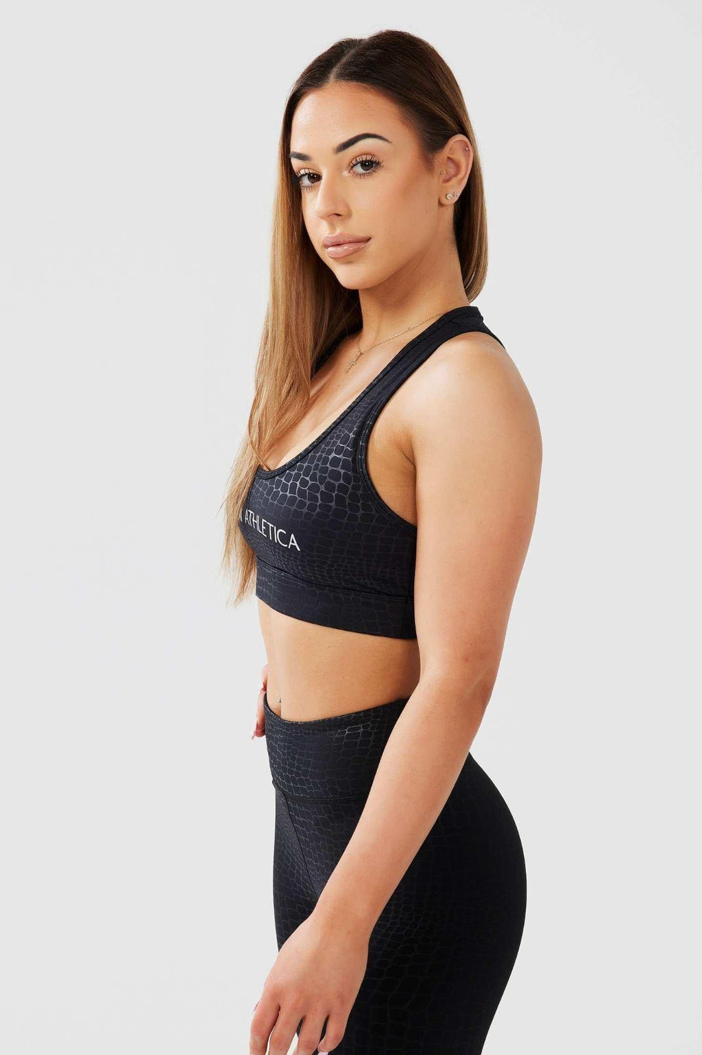 Side shot girl wearing luxe snake print crop top